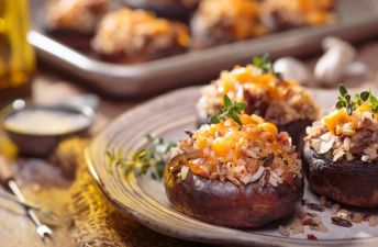 Wild Rice & Sausage Stuffed Mushrooms with cheese