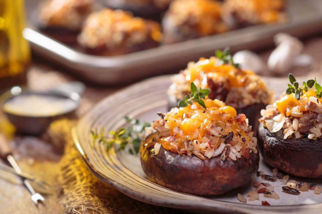 Wild Rice & Sausage Stuffed Mushrooms with cheese