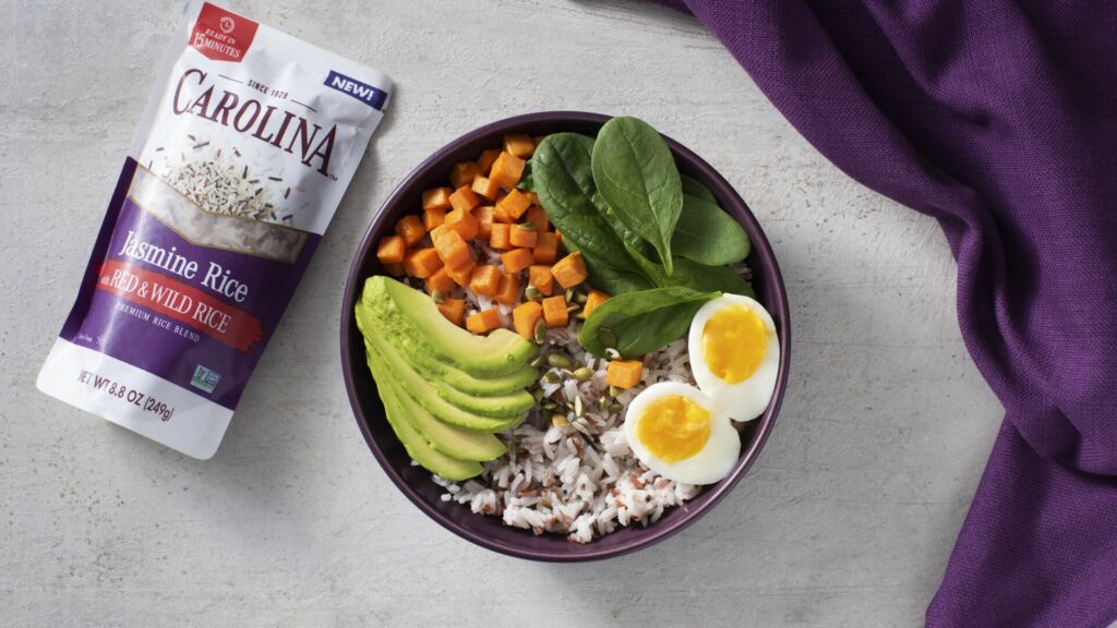 Breakfast rice bowl with turmeric rice, avocado and egg