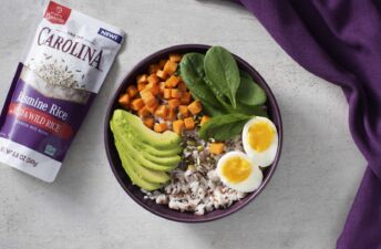 Breakfast rice bowl with turmeric rice, avocado and egg