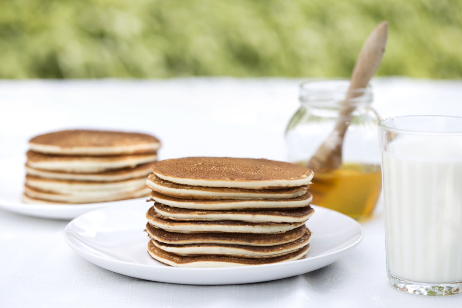 Stack of fluffy rice pancakes with syrup