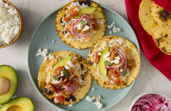 Tacos filled with chicken tinga and white rice