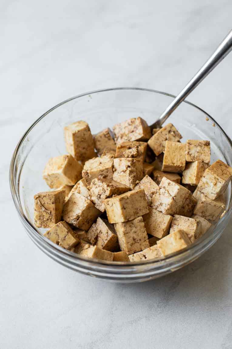 soaking the tofu in a sauce marinade