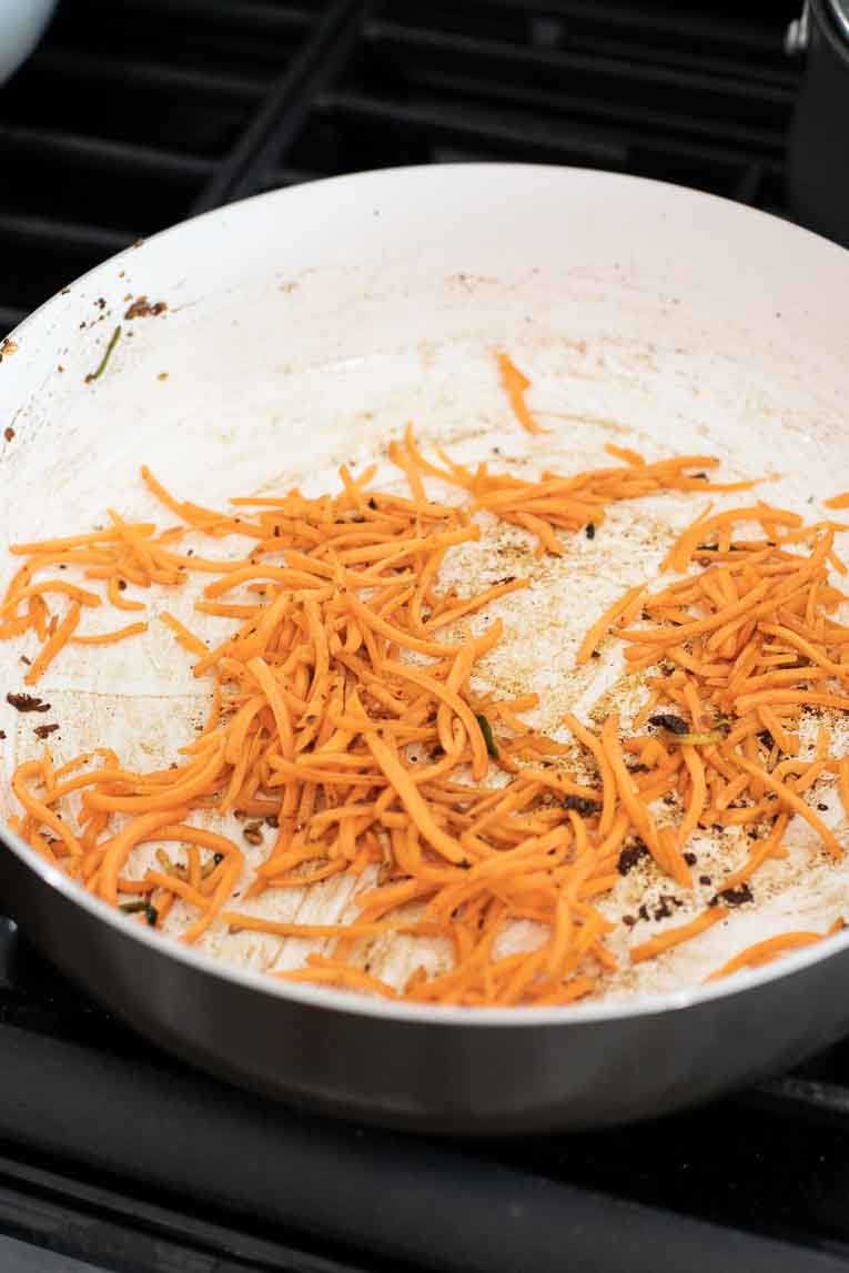 sauteeing sliced carrots