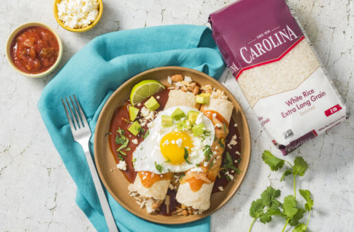 huevos-rancheros-enchiladas-filled-with-white-rice-chorizo-pinto-beans-and-topped-with-an-egg