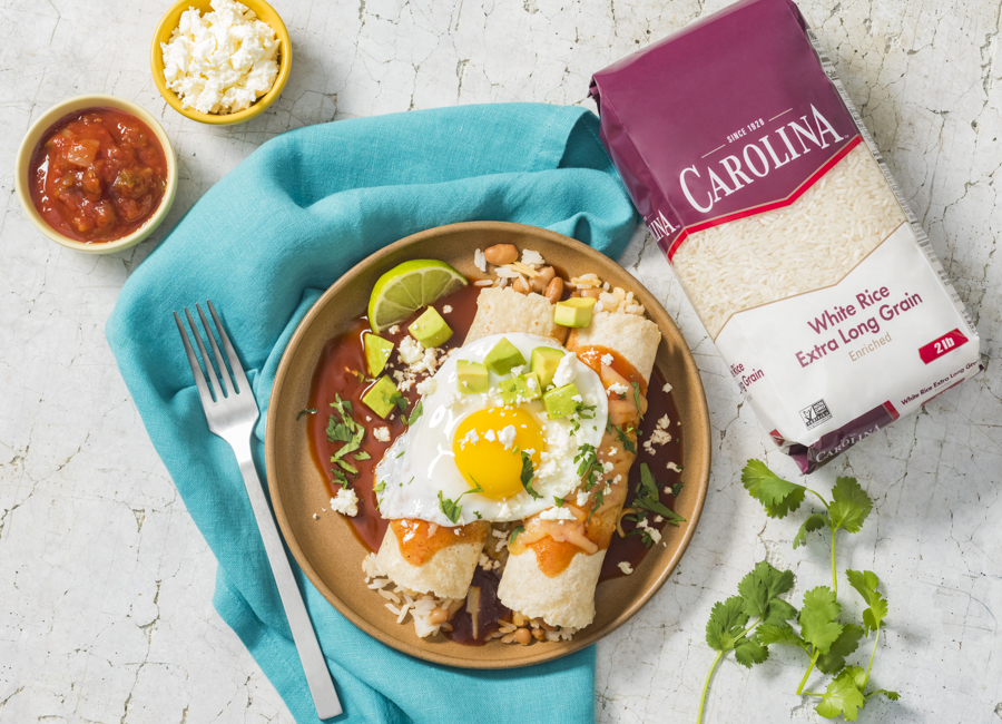 huevos-rancheros-enchiladas-filled-with-white-rice-chorizo-pinto-beans-and-topped-with-an-egg